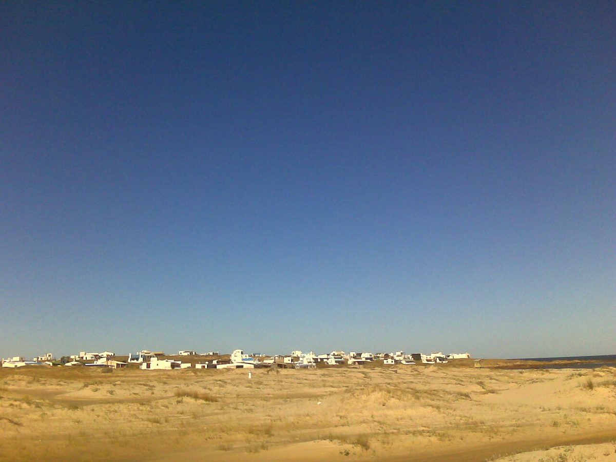 Wide empty Atlantic beach backed by sand dunes on the Rocha coast of Uruguay