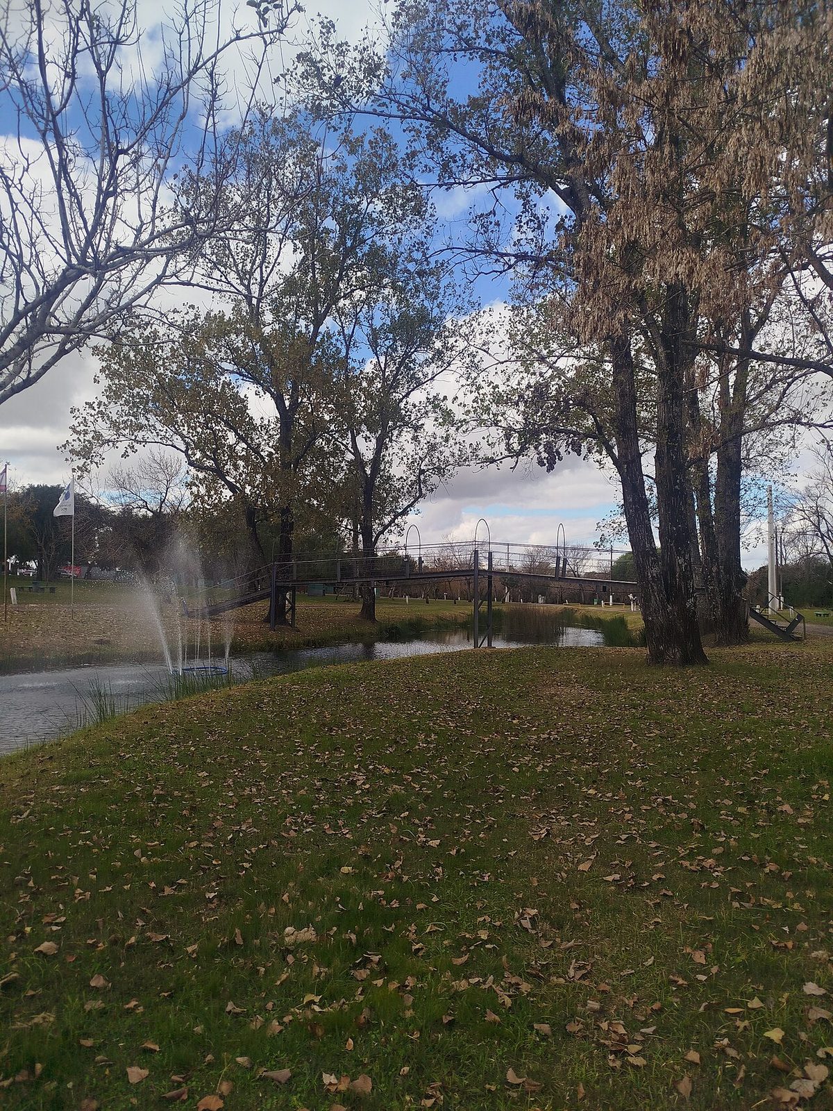 Grassy, tree-shaded camping grounds at the Guaviyu thermal complex near Paysandu