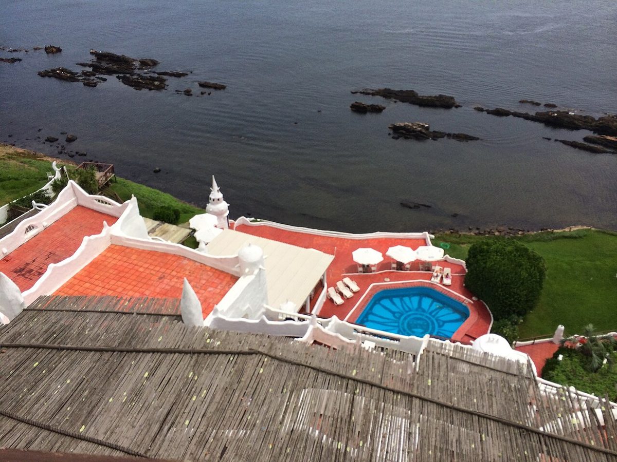 The white Mediterranean-style exterior of casapueblo on the cliffs at Punta Ballena, Uruguay