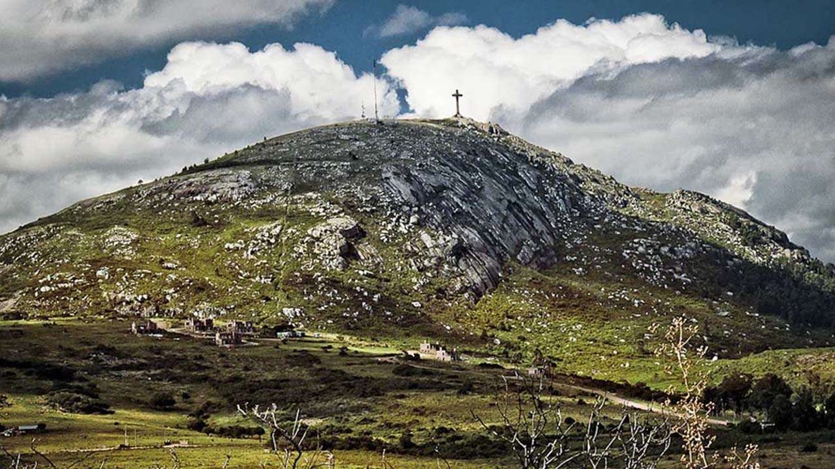 The summit of Cerro Pan de Azúcar with its tall concrete cross overlooking the coast