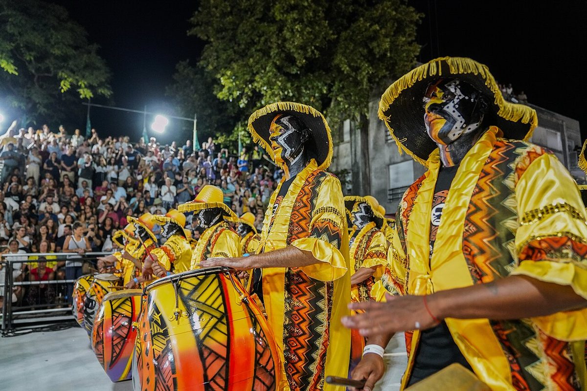 Candombe drummers parading down Isla de Flores street during the Desfile de Llamadas in Montevideo