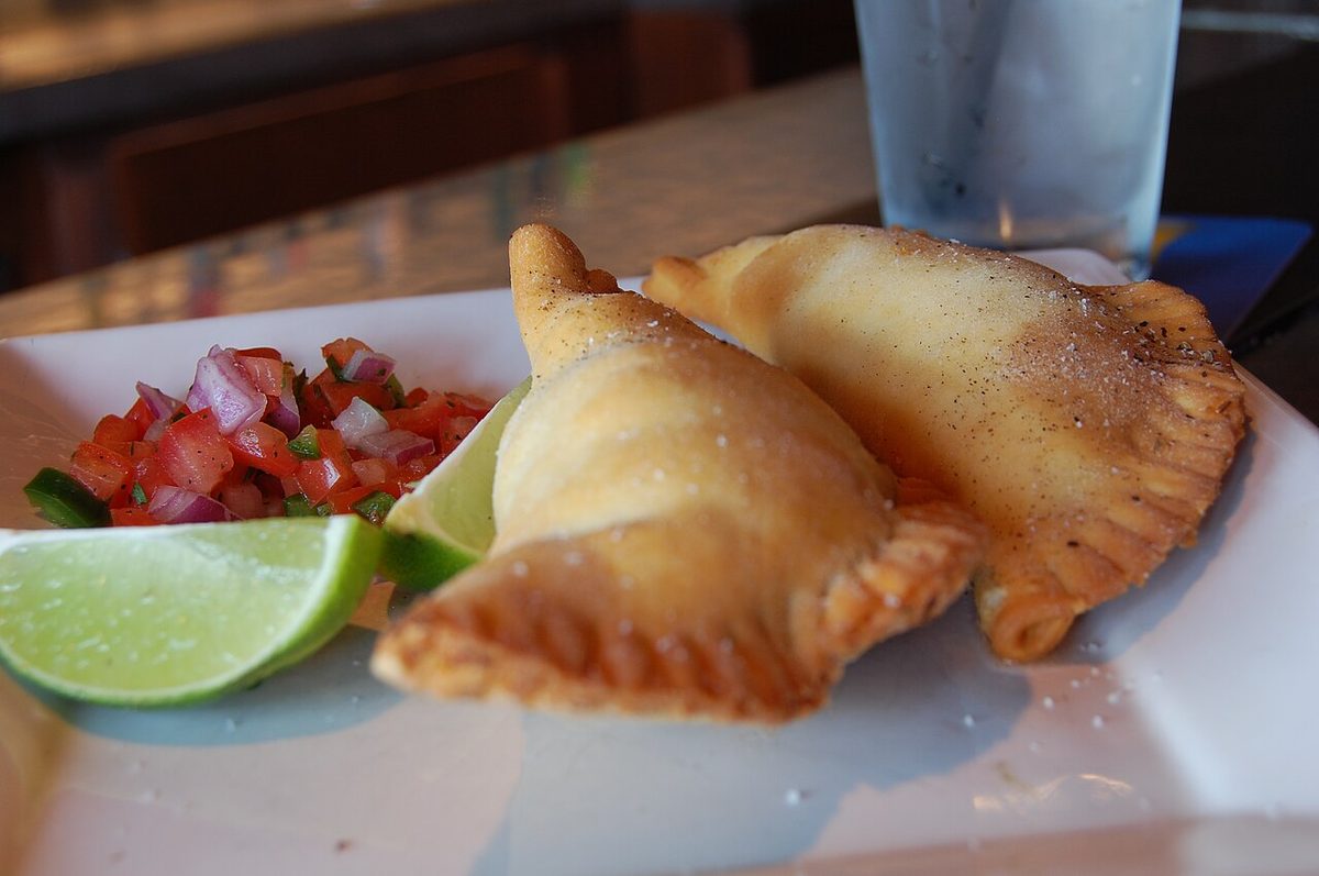 Baked empanadas de verdura filled with spinach and cheese