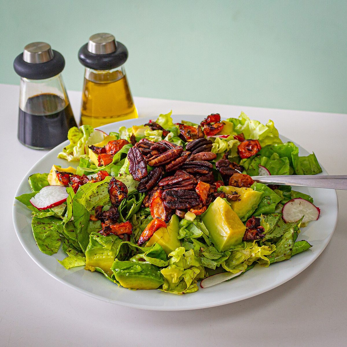 A simple mixed salad of lettuce, tomato and onion served at a Uruguayan parrilla