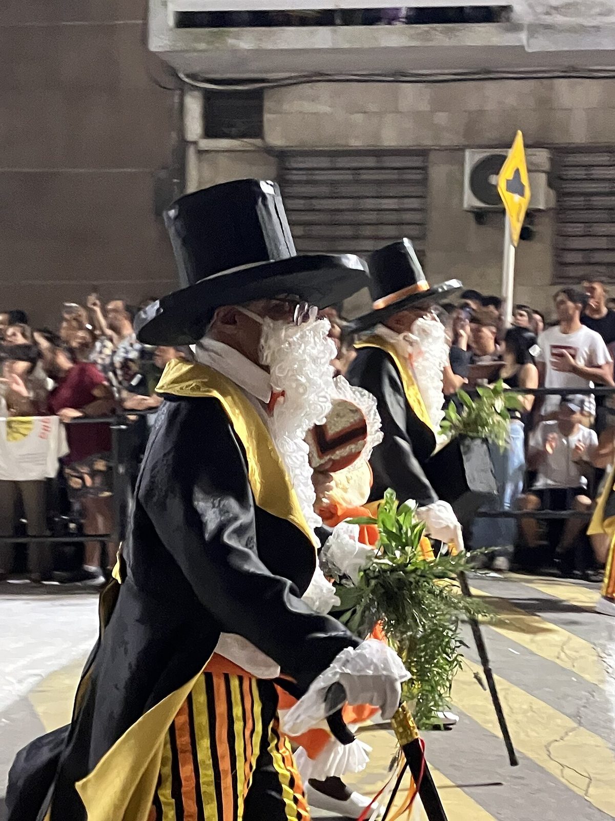 El gramillero, the top-hatted elder character of candombe, dancing with his cane.
