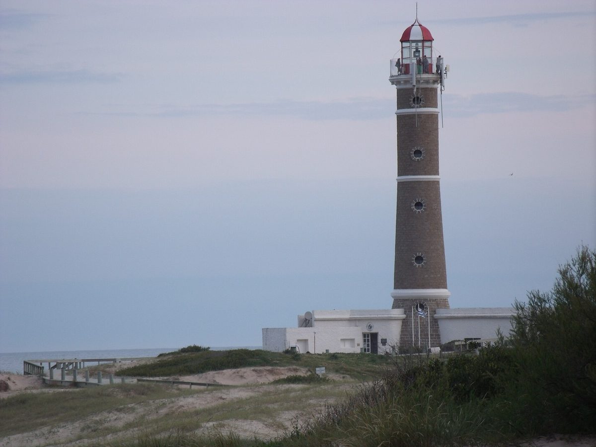 The Jose Ignacio lighthouse above dunes and beach grass at the tip of the village