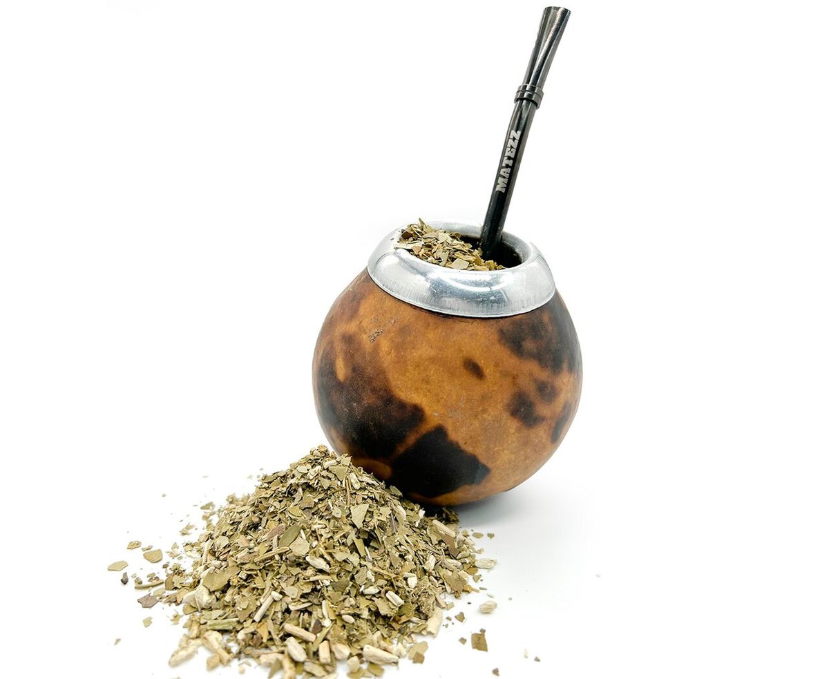 A traditional calabash mate gourd filled with yerba and a metal bombilla straw