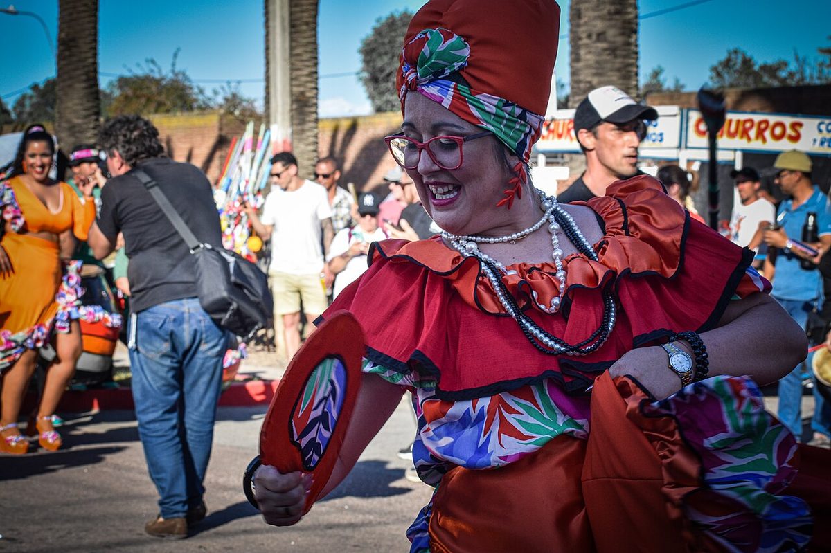 A mama vieja dancer in a comparsa during Montevideo Carnival.