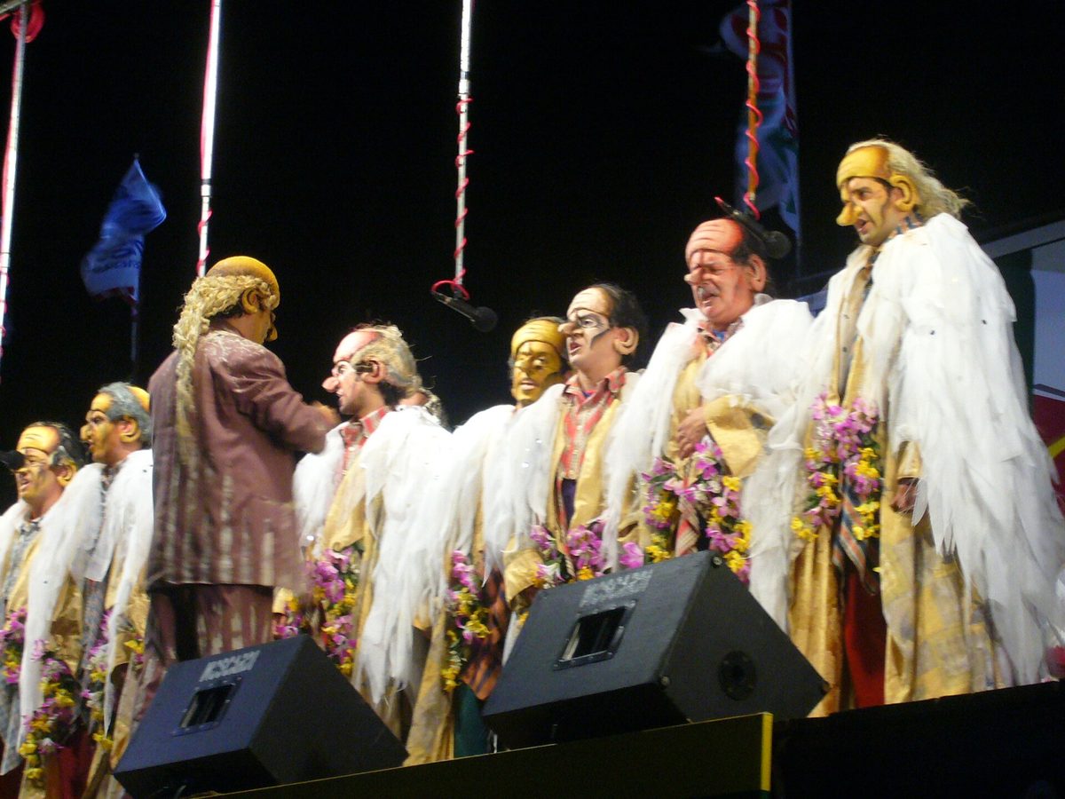 Murga performers in painted faces and bright costumes during Uruguay's 40-night carnival season