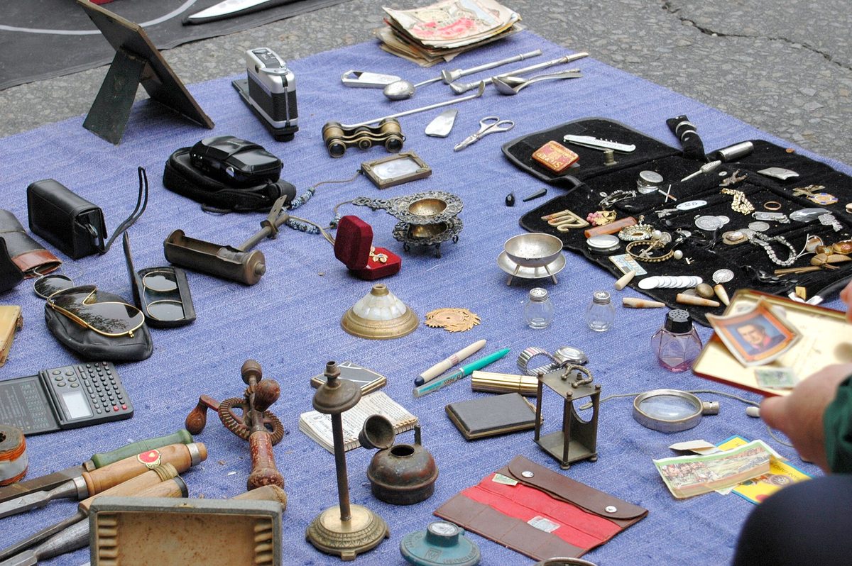 Antiques laid out on a vendor's blanket at Feria de Tristan Narvaja, Montevideo