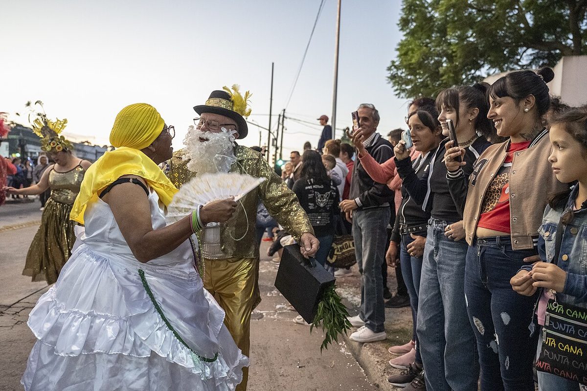 A neighbourhood carnival corso winding through a Montevideo barrio.