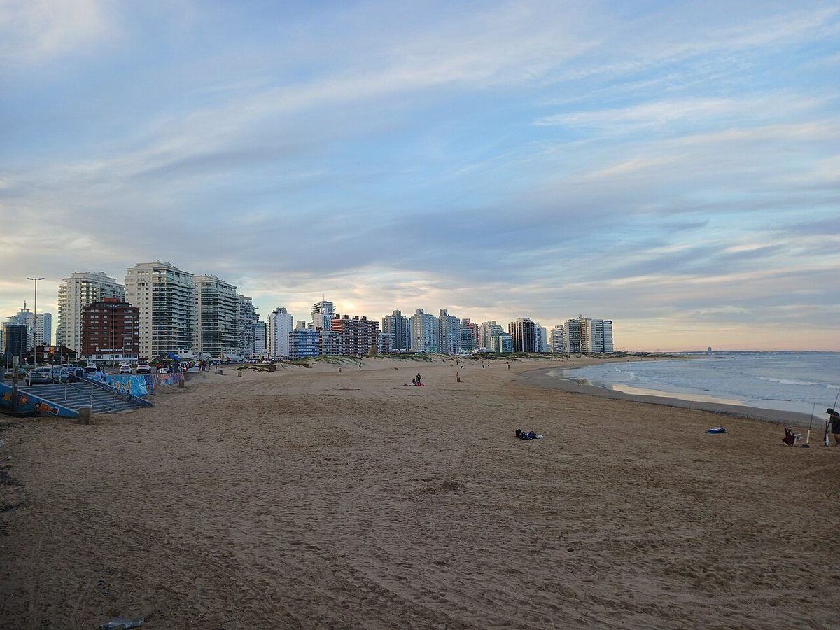 Playa Brava in Punta del Este with Atlantic surf and the hand sculpture in the distance