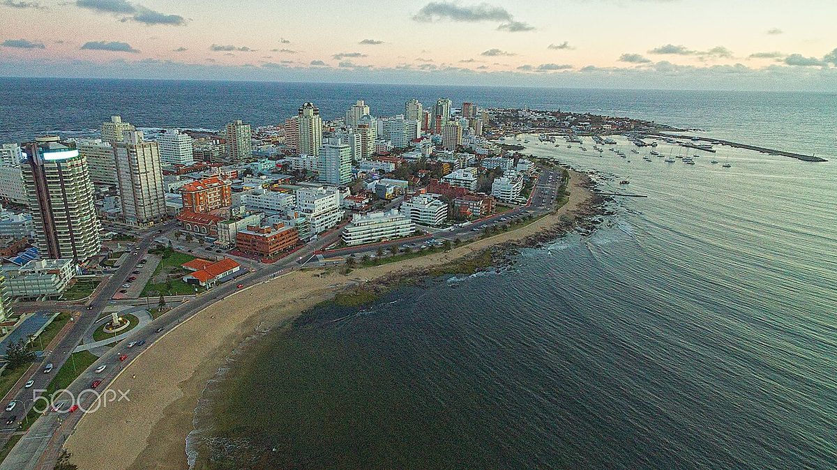 A calm beach and the strip of seafront hotels facing Playa Mansa in Punta del Este