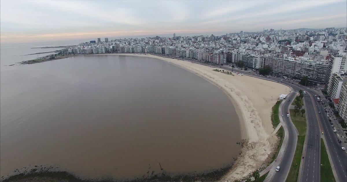 The full sweep of Playa Pocitos and the Montevideo skyline - the city's most popular beach in the best time to visit Uruguay