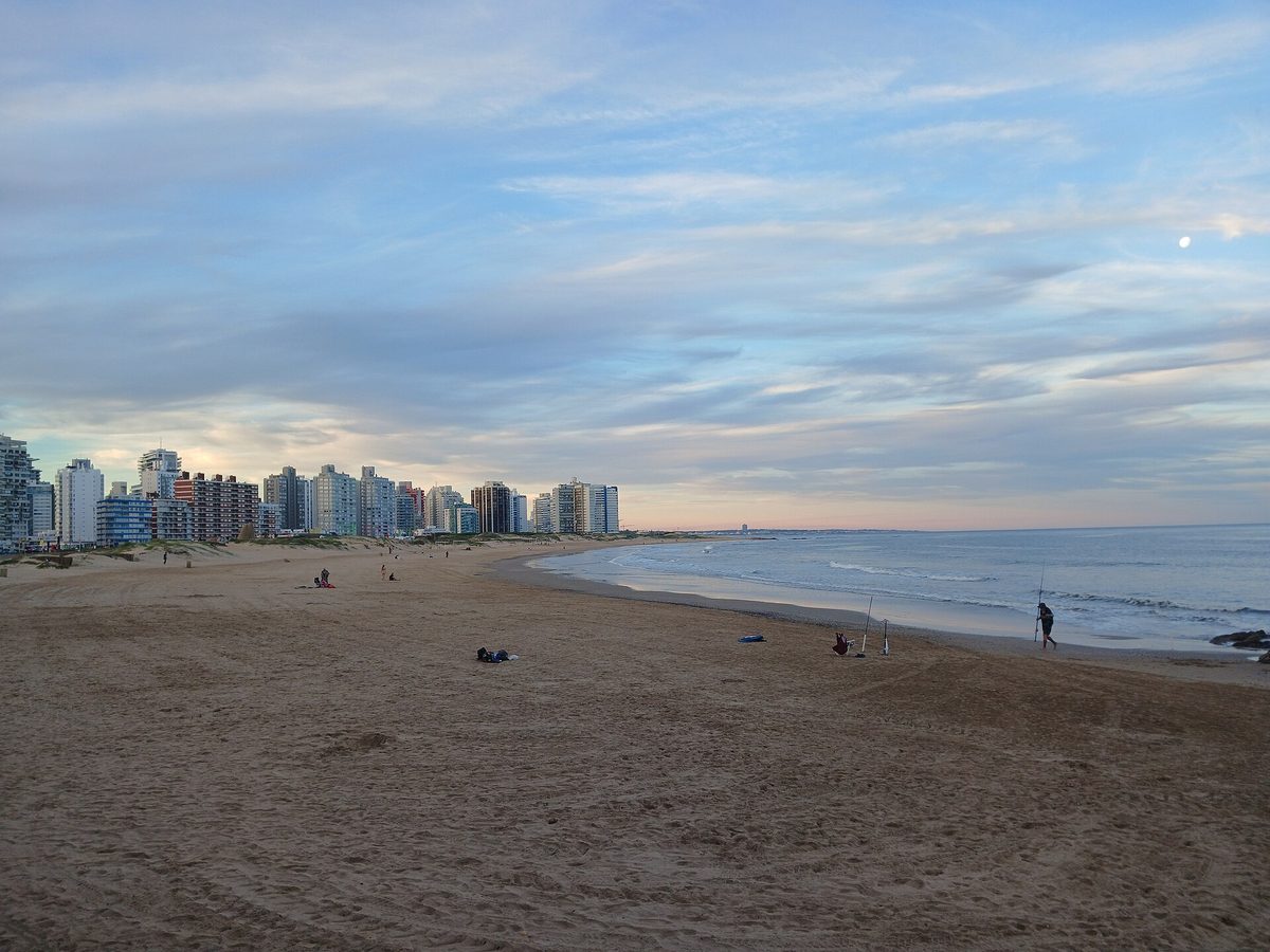 Playa Brava beach and the Punta del Este skyline at dusk