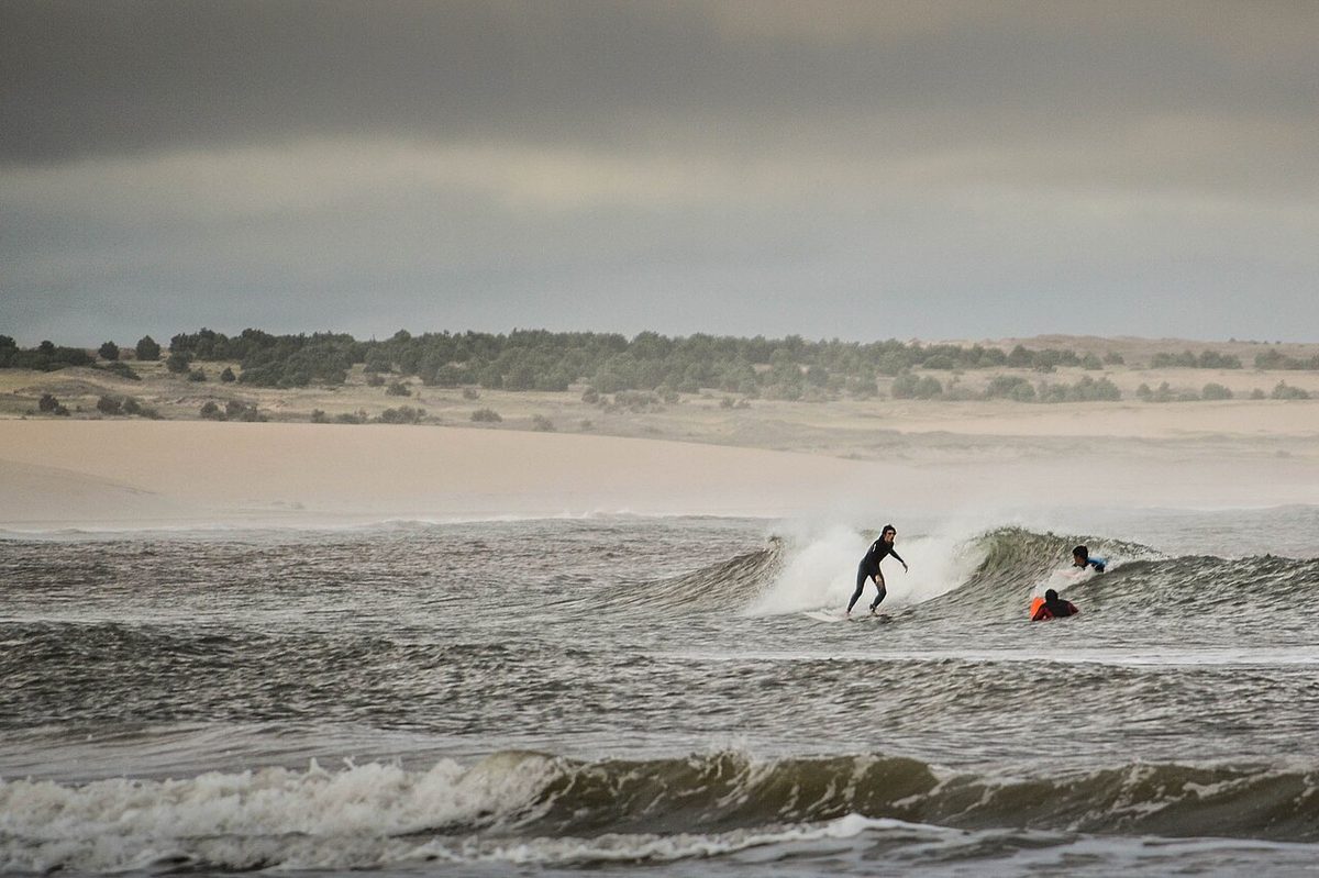A surfer drops into an Atlantic wave on Uruguay's Rocha coast, the kind of surf the La Paloma area is known for