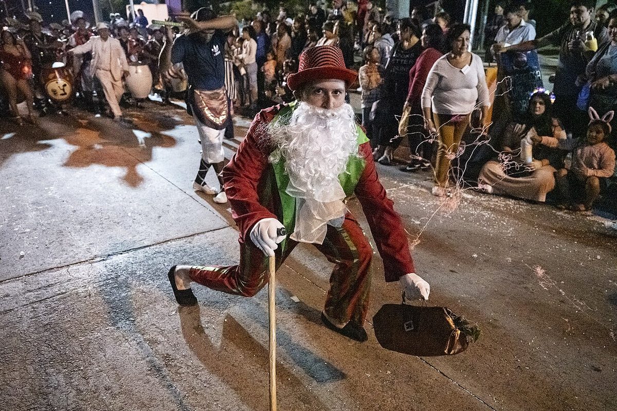 A neighbourhood carnival corso on a Montevideo street, the kind of stage where murga is seen.