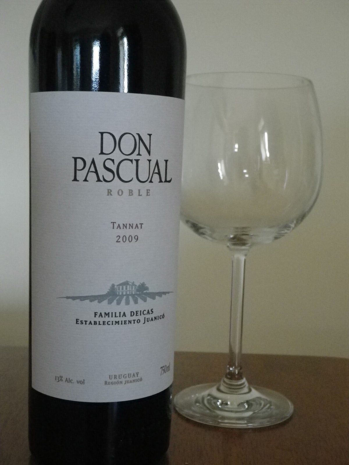 A glass of Uruguayan Tannat red wine poured to pair with asado