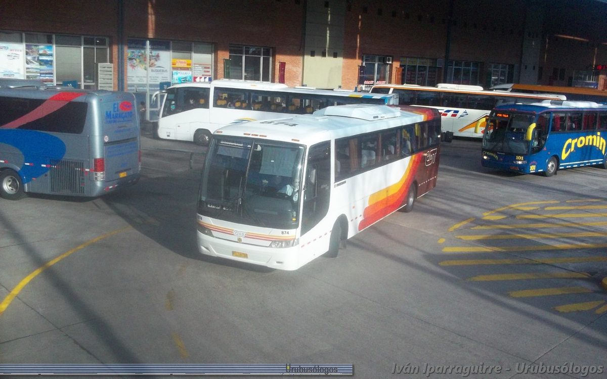 Travelers and bus company counters inside the Tres Cruces bus terminal in Montevideo