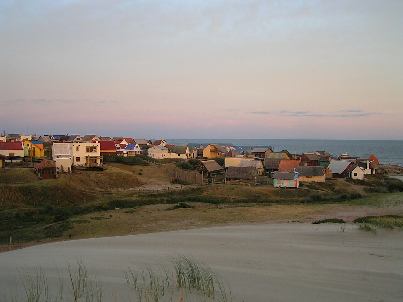 Sunset at Punta del Diablo beach on Uruguay's Atlantic coast — all 660 km of beaches are free