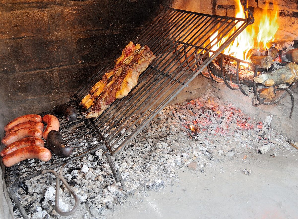 A loaded asado grill of beef and sausages, the centrepiece of Christmas in Uruguay