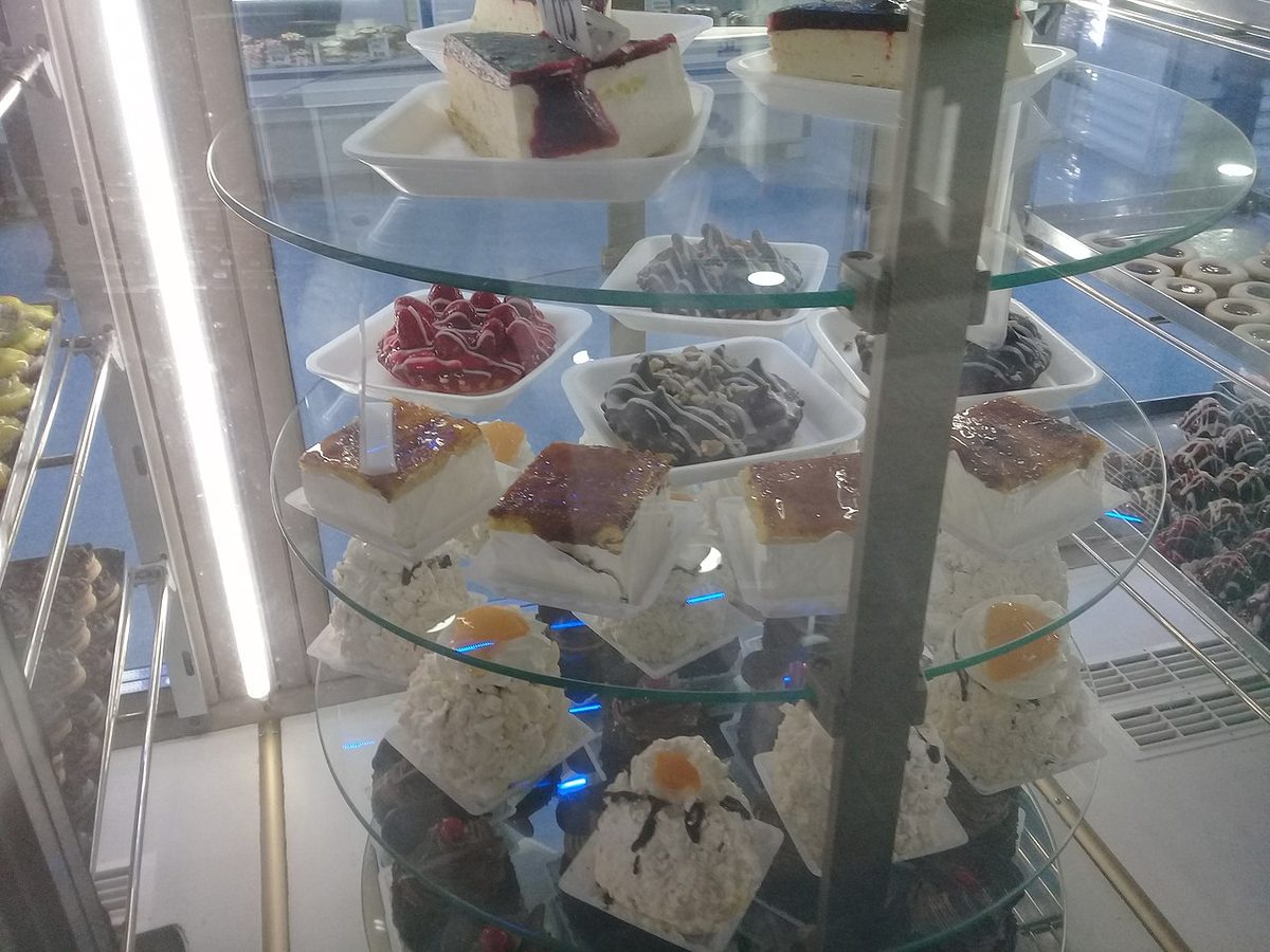 An assortment of uruguayan desserts including alfajores, chajá and dulce de leche on a table