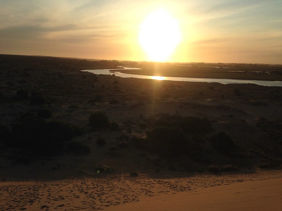 Walkers crossing the giant dunes on the Barra de Valizas route to Cabo Polonio