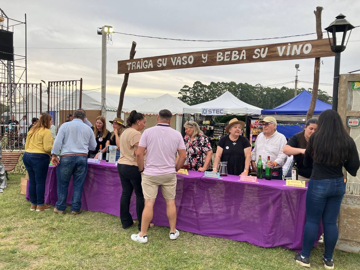 Bring your glass and drink your wine - a grape harvest festival (vendimia) stand in rural Uruguay